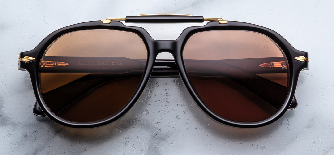 Front view of Jacques Marie Mage 1991 Eclipse 2 sunglasses showing polished black 10 mm cured cellulose acetate aviator frame with warm hazel-brown crown-mineral lenses, available at WINK Optometrists