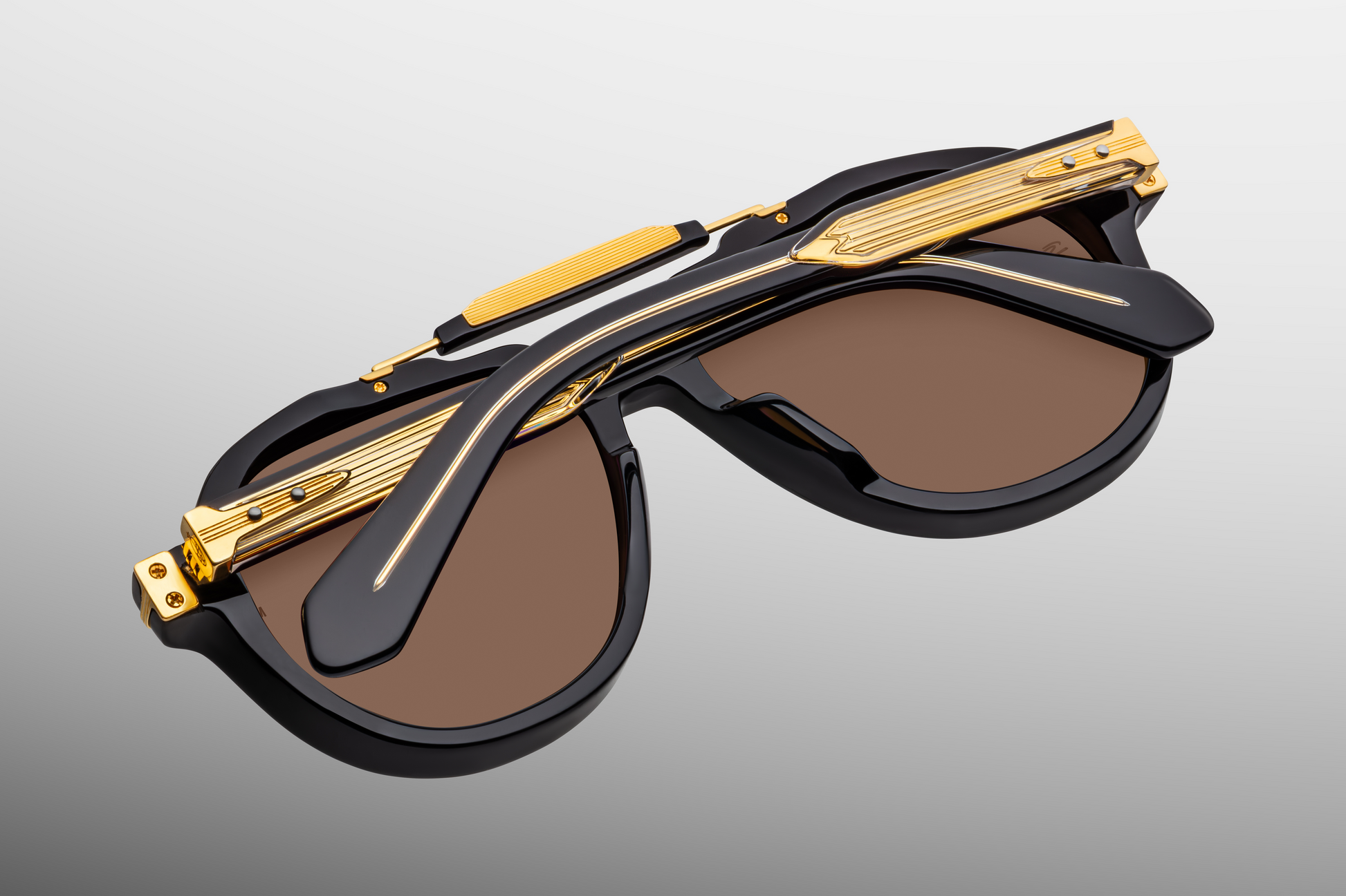 Back view of Jacques Marie Mage 1991 Eclipse 2 sunglasses with temples folded, revealing the polished interior of the acetate frame and foil-stamped limited-edition serial on the inner temple, available at WINK Optometrists