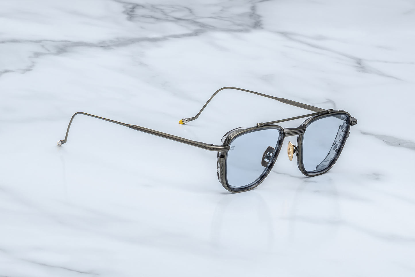 Side profile of Jacques Marie Mage Ayrton Senna 1992 Antique Gunmetal sunglasses showing the sleek temple in matte gunmetal beta-titanium with hand-painted yellow epoxy tip and polished silver palladium bezel, available at WINK Optometrists