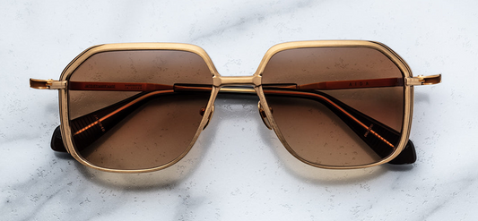 Front view of Jacques Marie Mage Aida Gold glasses showcasing bold cat-eye silhouette and gold metal frame at WINK Optometrists Melbourne