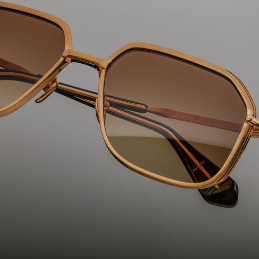 Close-up of Aida Gold frame detailing the engraved metalwork and luxe finishing touches