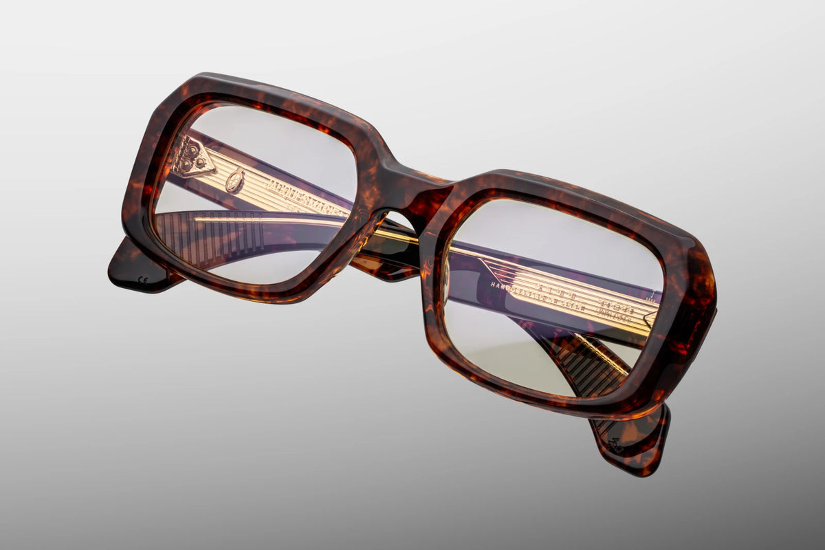 Top-down view of the Jacques Marie Mage Aldo RX Argyle eyeglasses, highlighting the structural thickness of the 10mm block acetate face and the substantial width of the frame profile. The inner clear lamination of the temples reveals the full length of the engraved metal wire core and the robust 7-barrel hinge mechanism. Available at WINK Optometrists.