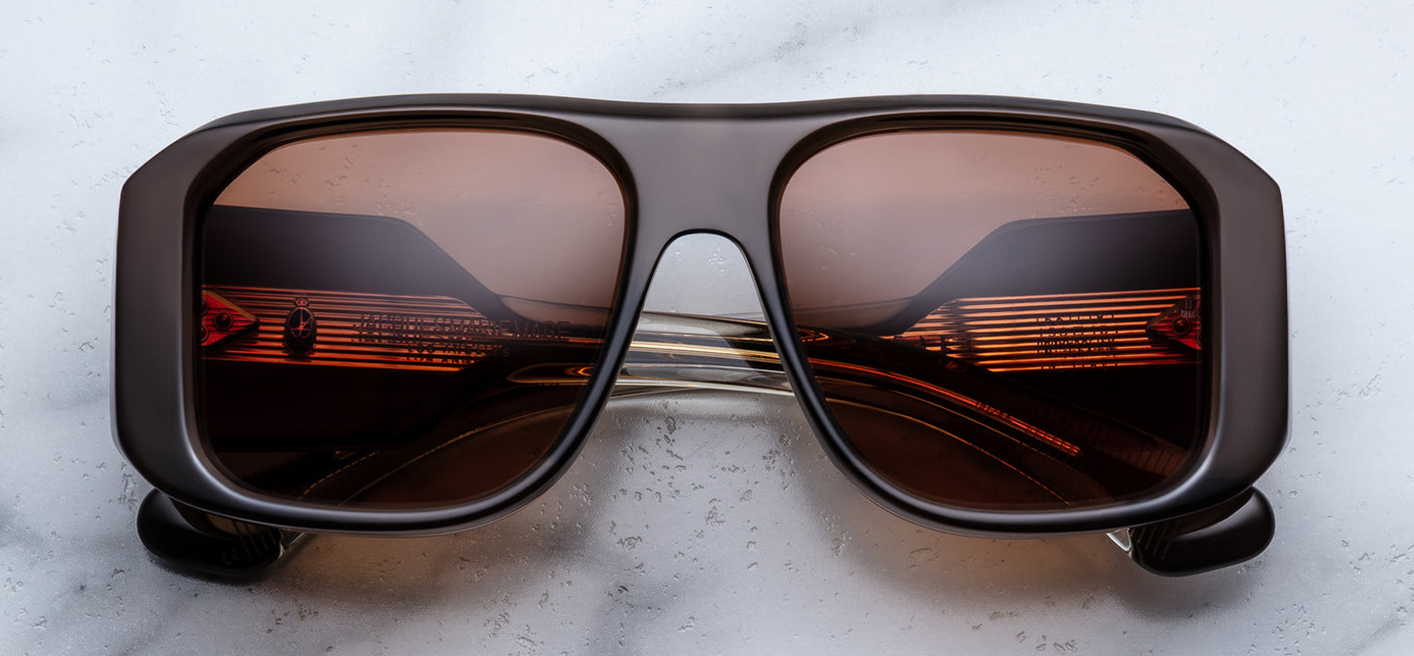 Jacques Marie Mage Alfie sunglasses in London front view – bold rectangular grey acetate frame with tinted lenses and signature arrowhead rivets – available at Wink Optometrists