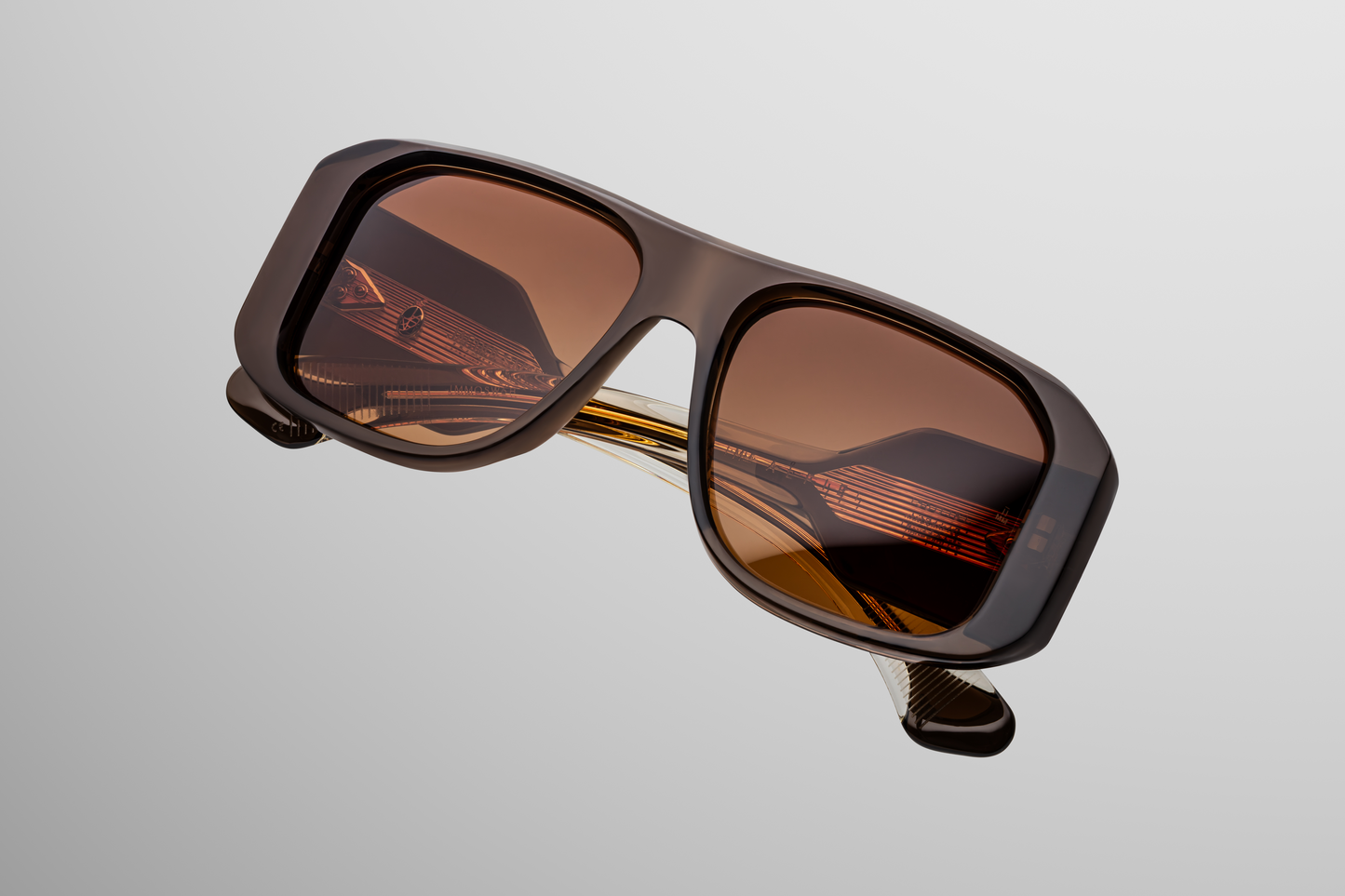 Close up front detail of Jacques Marie Mage Alfie sunglasses in London showing signature arrowhead rivets, sculpted acetate frame and tinted lenses – available at Wink Optometrists