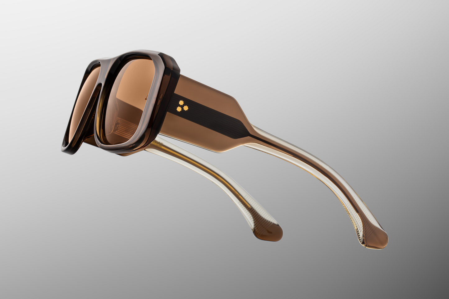 Close up temple detail of Jacques Marie Mage Alfie London sunglasses showing engraved wire core inside grey acetate temples – available at Wink Optometrists