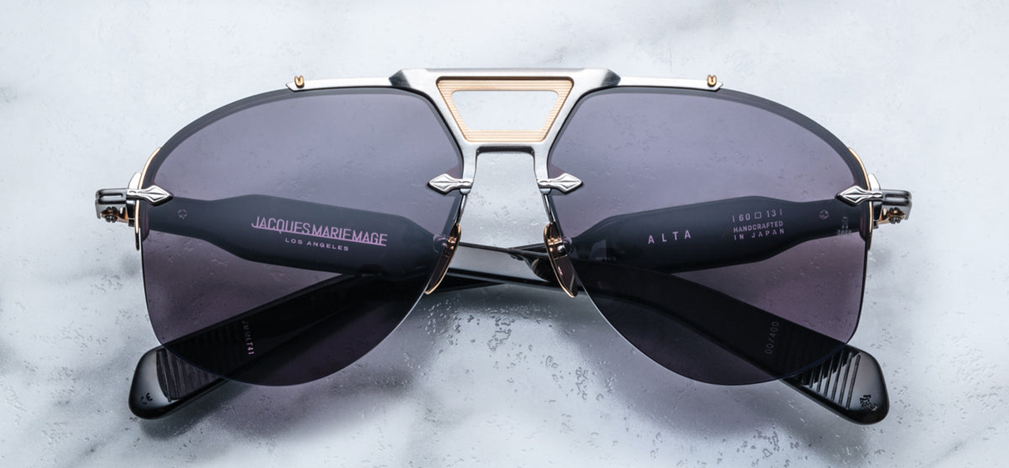 Rimless Series aviator sunglasses with dual-tone metal details, sculptural acetate temples, and blue titanium frame. Handcrafted in Japan.