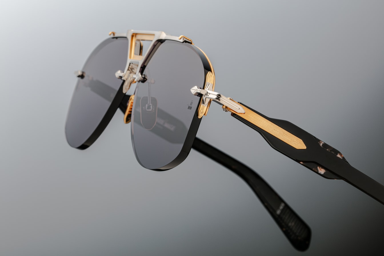 Rimless Series aviator sunglasses with dual-tone metal details, sculptural acetate temples, and blue titanium frame. Handcrafted in Japan.