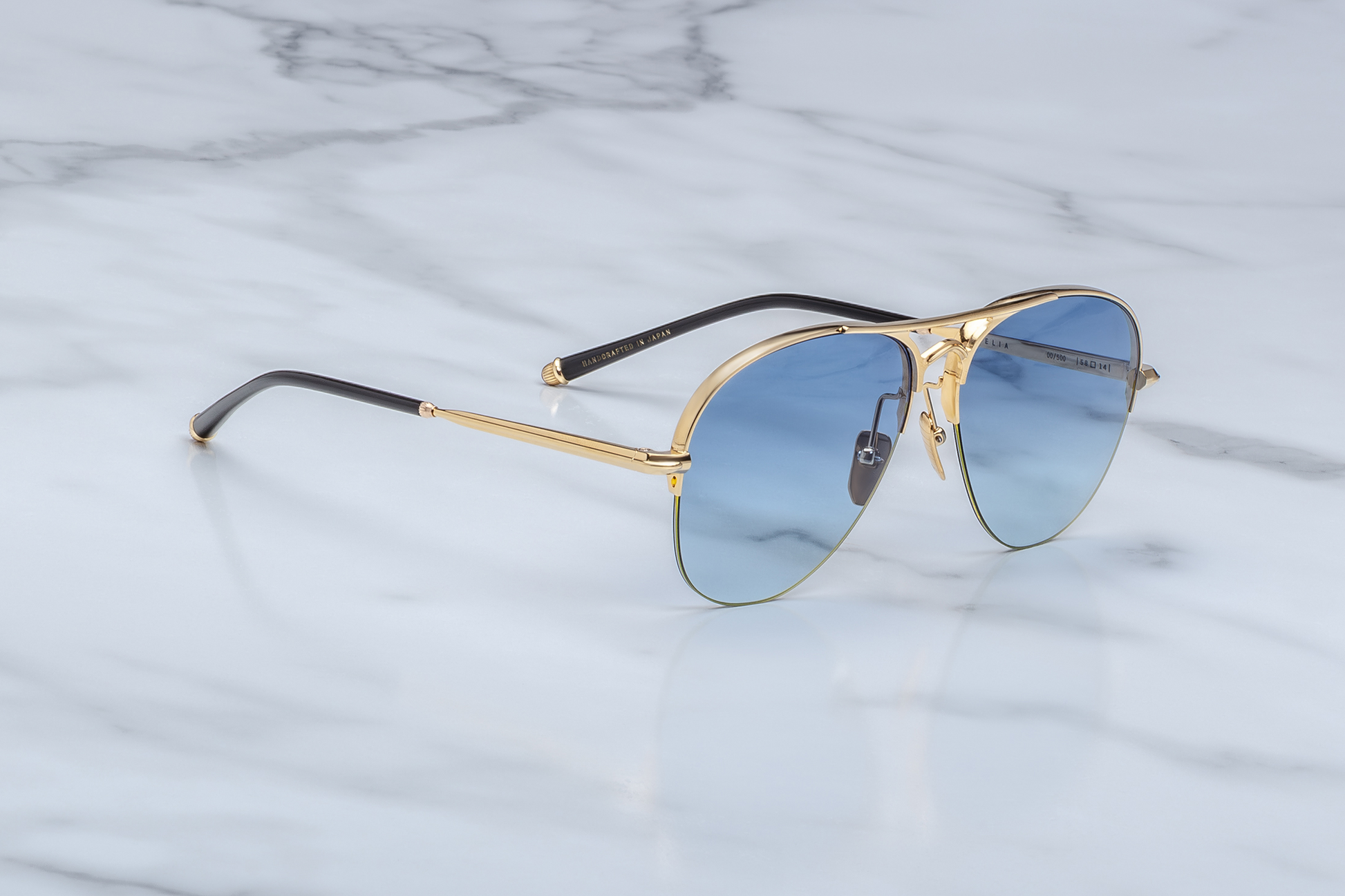 Side view of Jacques Marie Mage Amelia Gold luxury aviator sunglasses with gold titanium frame, arched double bridge, and Art Deco temples.