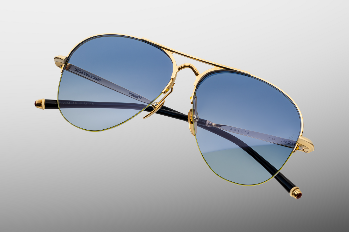 top view of Jacques Marie Mage Amelia Gold sunglasses showing double bridge design and slim titanium aviator frame construction.