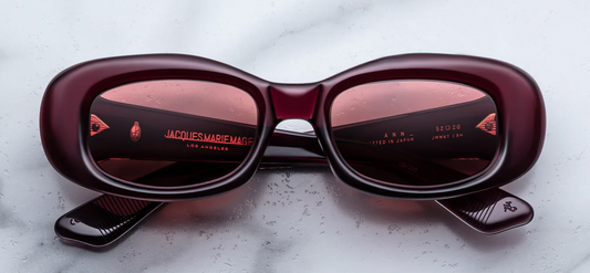 Jacques Marie Mage Ann Amarena sunglasses front view, rectangular butterfly-inspired frame in deep cherry red acetate with sculpted 90s silhouette
Front view of JMM Ann Amarena glasses, medium-fit rectangular eyewear in rich red acetate with signature metal rivets