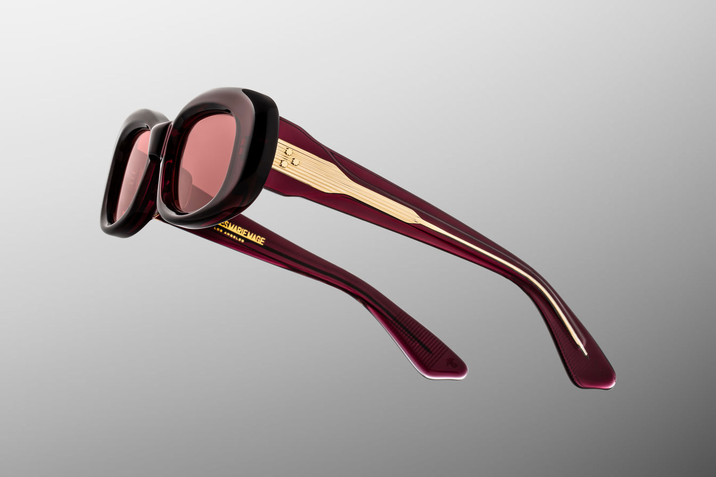 Close-up side detail of Jacques Marie Mage Ann Amarena showing engraved wirecore, hinge construction and layered acetate temples
Macro side view of JMM Ann Amarena highlighting premium hardware and precision craftsmanship