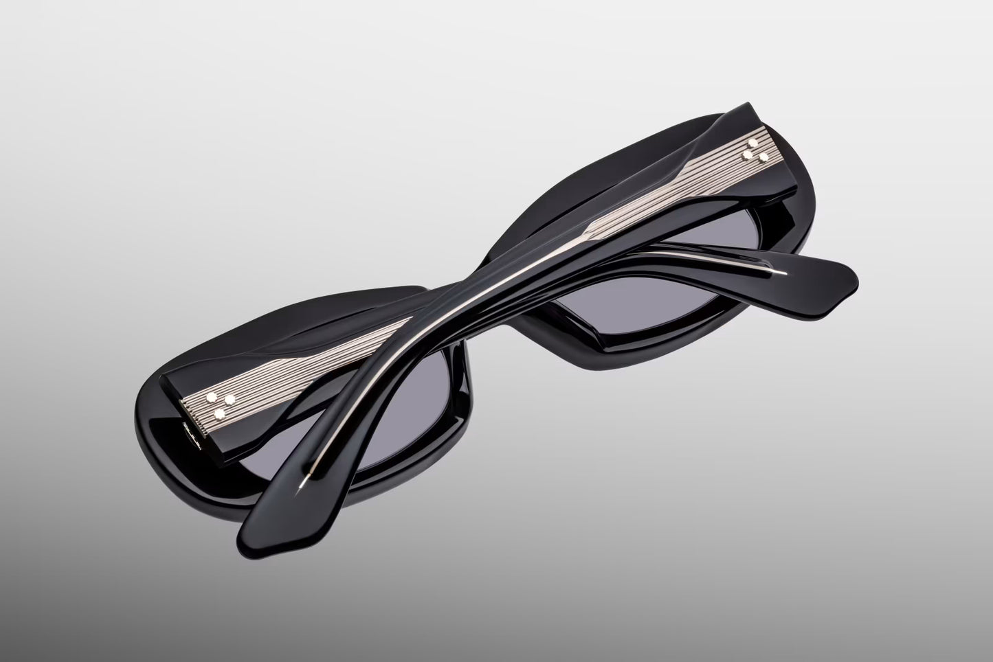 Close-up back view of Jacques Marie Mage Ann Raven sunglasses showing inner temple engraving and exposed cantilever wirecore
Rear detail of JMM Ann Raven frame revealing handcrafted acetate interior and limited edition markings