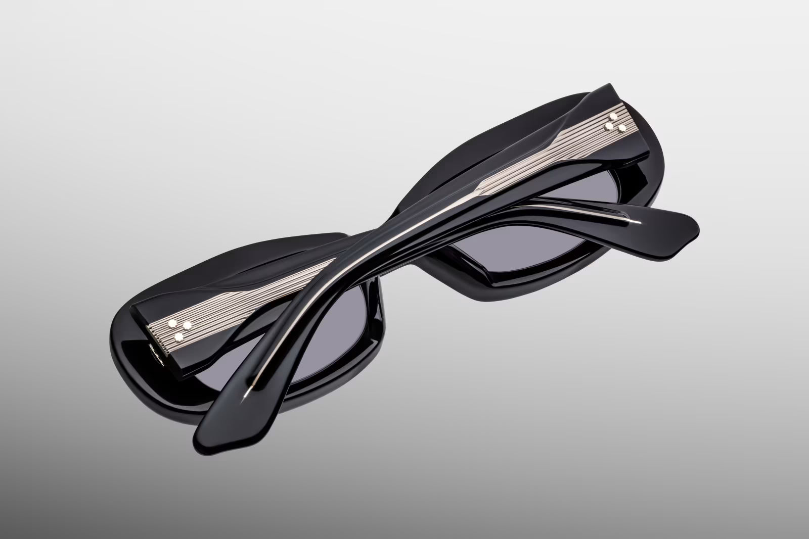 Close-up back view of Jacques Marie Mage Ann Raven sunglasses showing inner temple engraving and exposed cantilever wirecore
Rear detail of JMM Ann Raven frame revealing handcrafted acetate interior and limited edition markings
