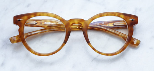 Front view of Jacques Marie Mage Arp Camel glasses showcasing warm camel acetate with bold rectangular shape