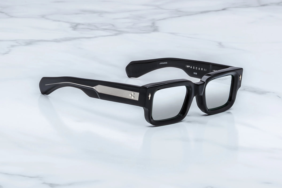 Side profile of JMM Ascari Black Mirror sunglasses highlighting custom double-laminated black acetate temples.
