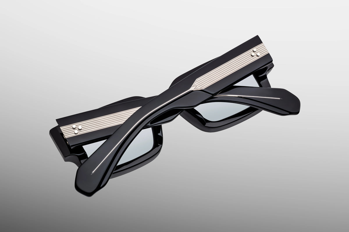 Rear view of JMM Ascari Black Mirror glasses showcasing custom silver hairline-detailed 7-barrel hinges.