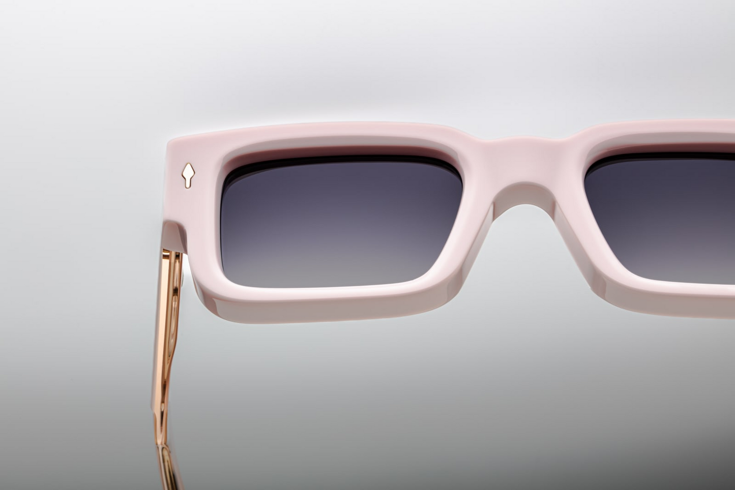 Close-up of Jacques Marie Mage Ascari sunglasses in Marshmellow acetate highlighting premium craftsmanship and engraved metal accents, available at WINK Optometrists.