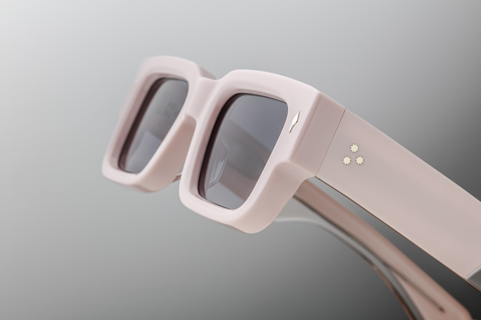 Temple detail of Jacques Marie Mage Ascari in Marshmellow showing the JMM logo engraving and intricate hinge design, available at WINK Optometrists.