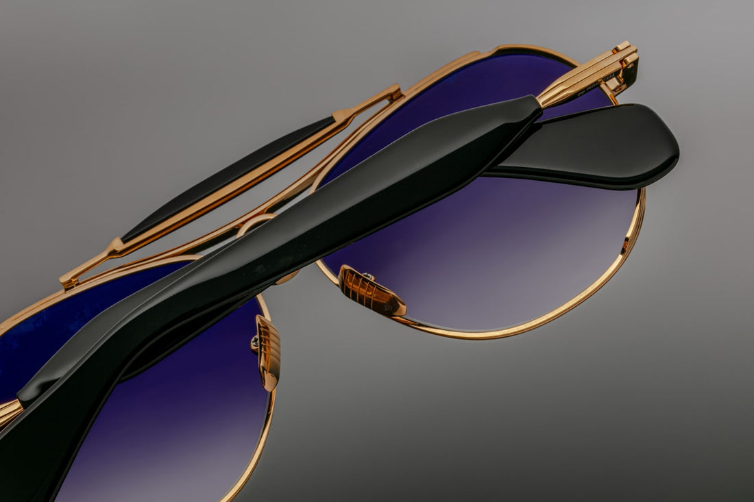Jacques Marie Mage Aspen seen from above, emphasizing elegant frame curvature and gold-black contrast