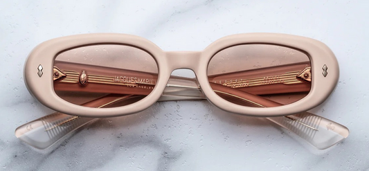 Front view of Jacques Marie Mage Besset Dust Suede sunglasses in matte pastel peach cellulose acetate, ’90s‑inspired petite oval shape with light-gold double-arrowhead front pins and soft suede‑textured finish.”
Includes high-impact SEO terms like Jacques Marie Mage Besset Dust Suede, matte pastel peach acetate, ’90s‑inspired oval, and double‑arrowhead front pins