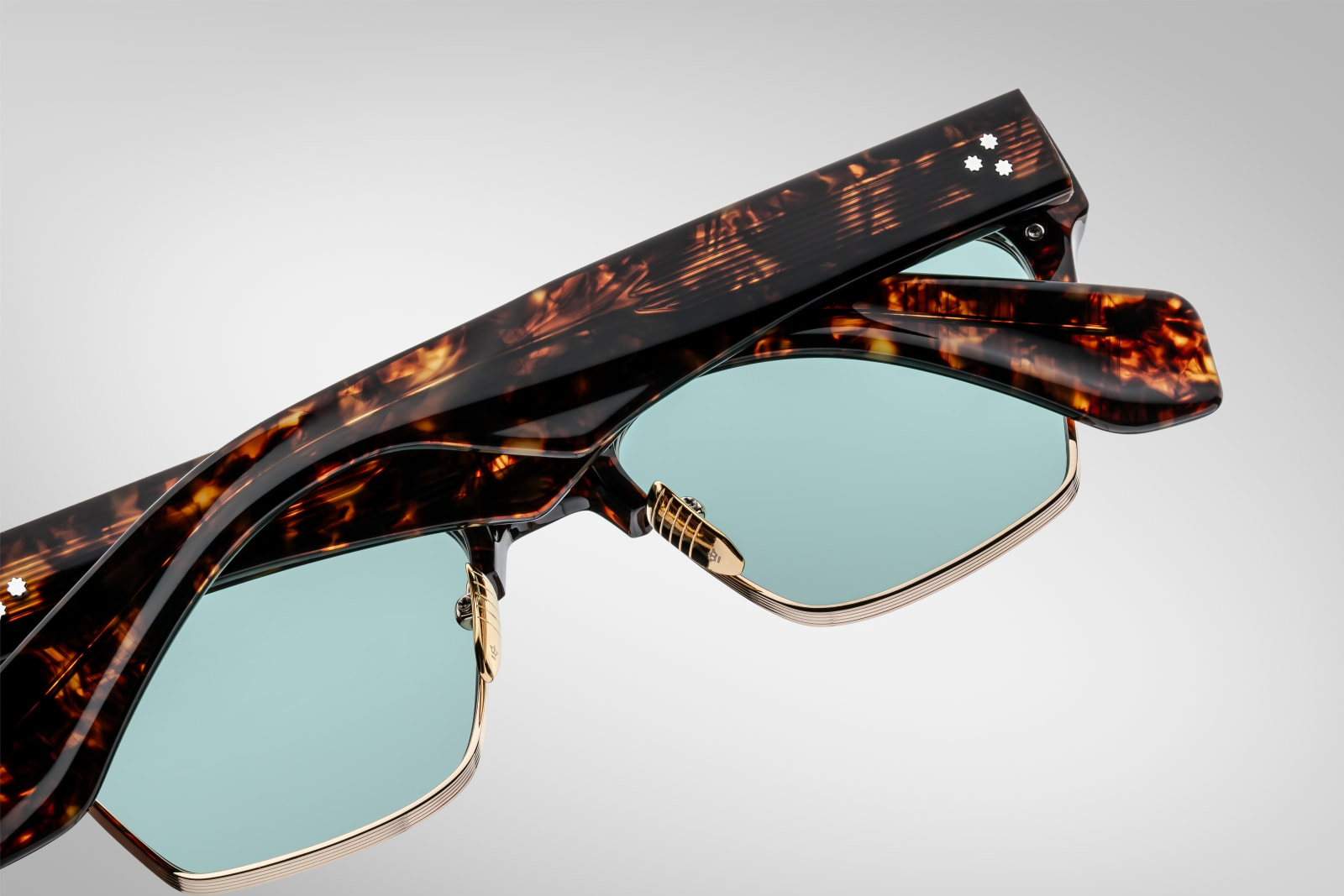Back view of Bugsy in Beau showing turquoise CR‑39 lenses with backside anti‑reflective treatment, 100% UV protection, and precision craftsmanship of the beta titanium acetate combo frame