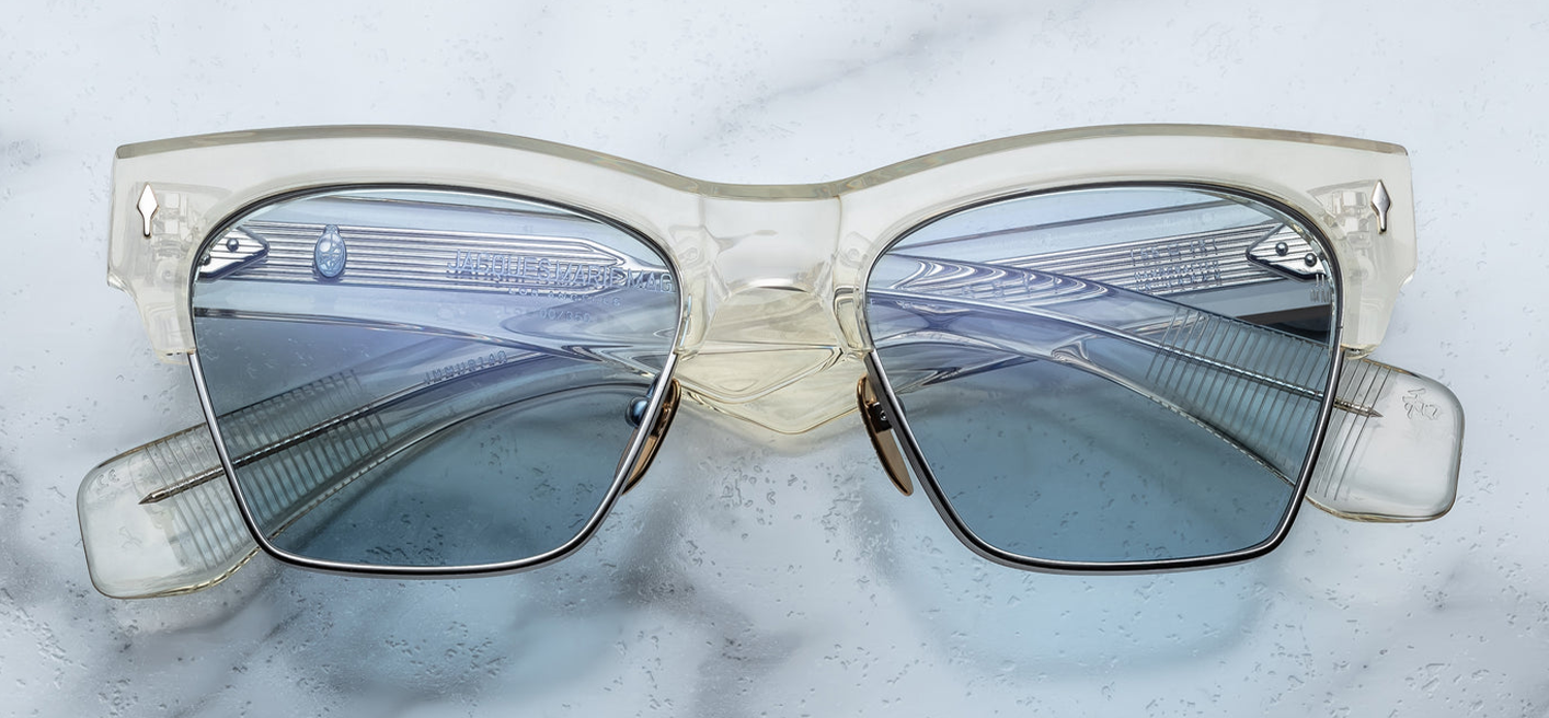Front view of Jacques Marie Mage Bugsy Brut—mid‑century clubmaster sunglasses with silver beta titanium rim, crystal‑clear acetate brow, Blue Bird CR‑39 lenses, and silver arrow‑head front pin