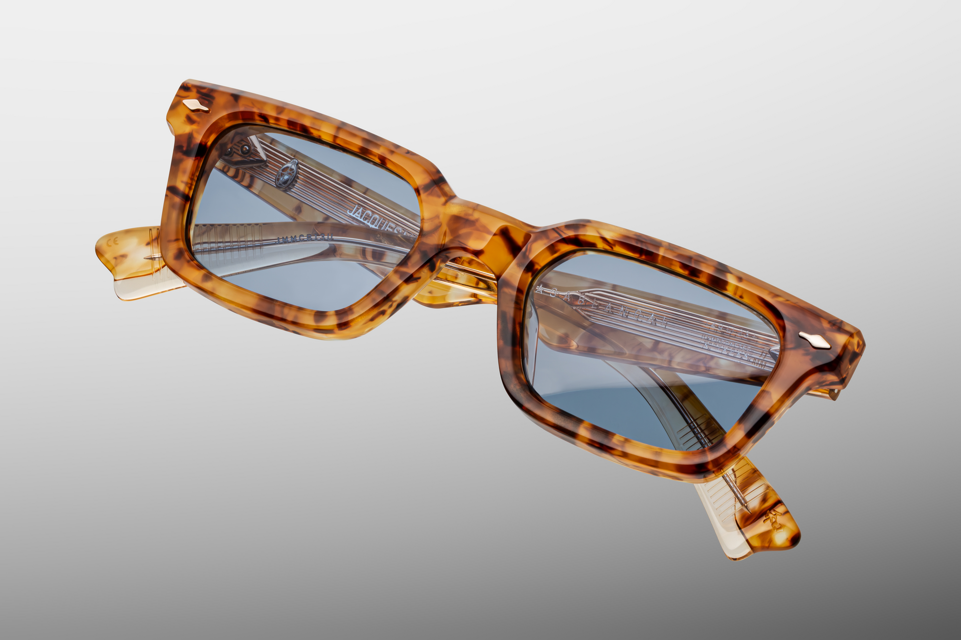 Close-up of Jacques Marie Mage Casablanca sunglasses in Cairo highlighting handcrafted acetate texture, engraved metal detailing, and polished lens edges, available at WINK Optometrists.