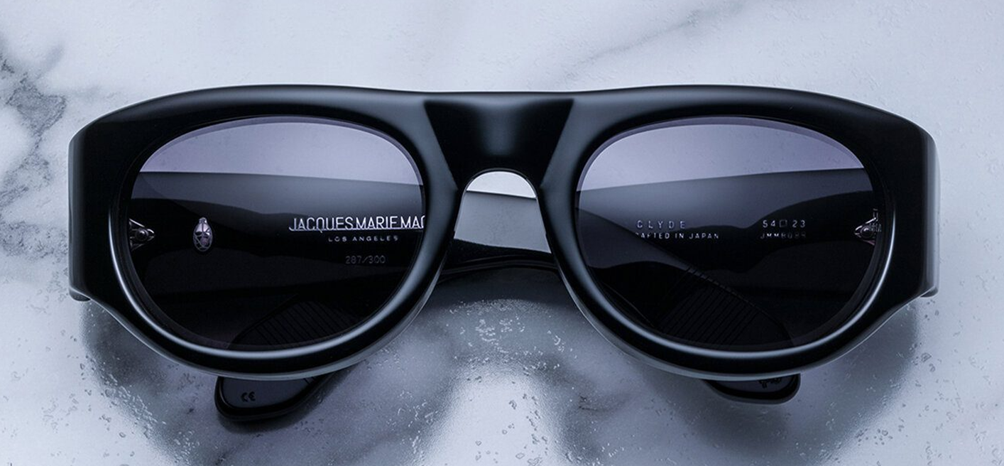 Front view of Jacques Marie Mage Clyde sunglasses in Black, featuring a bold rectangular black acetate frame, available at WINK Optometrists.