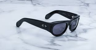 Side profile of Jacques Marie Mage Clyde in Black showing sculpted temples, signature metal hinges, and polished black finish, available at WINK Optometrists.