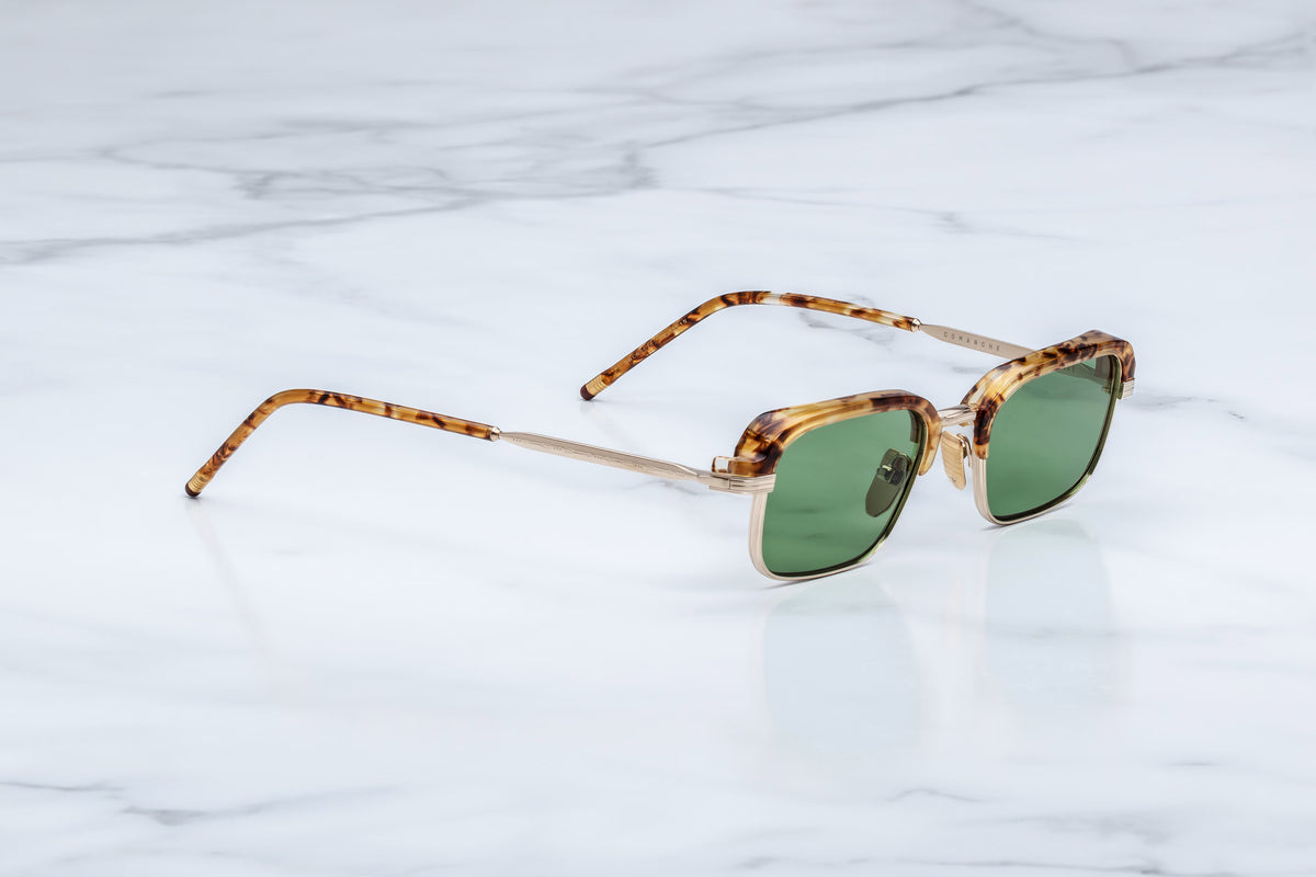 Three-quarter studio shot of the Jacques Marie Mage Comanche in Vintage Tortoise, showing the combination of structural gold titanium and premium tortoise acetate inner rim detailing.