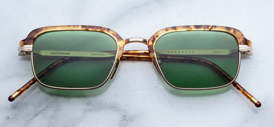 Front view of Jacques Marie Mage Comanche sunglasses in Vintage Tort, displaying the soft rectangular light gold titanium frames, vintage tortoise acetate top rim, and vintage green lenses.