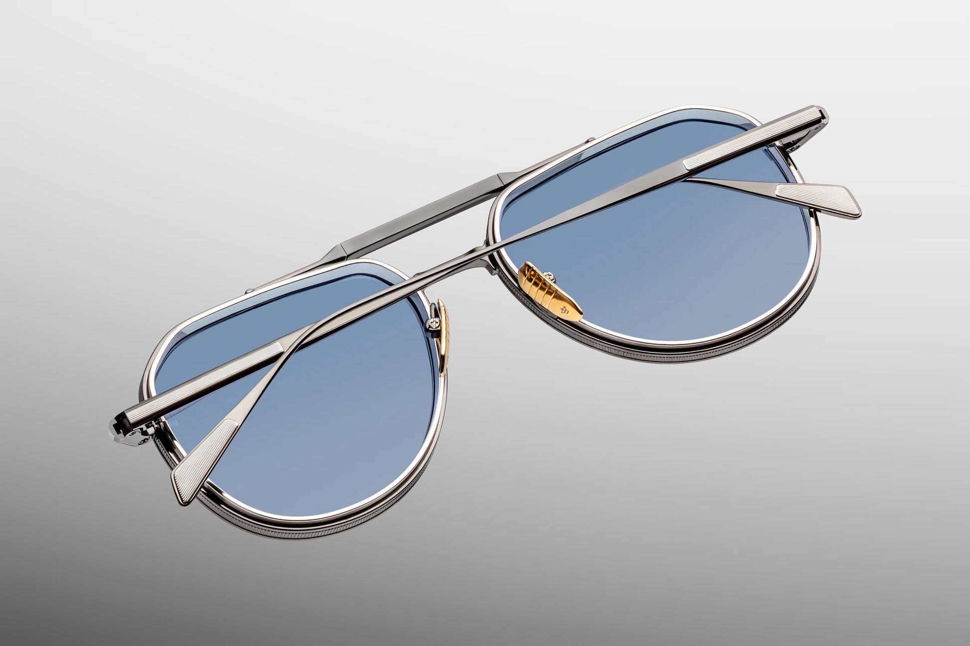 Close-up back view of Jacques Marie Mage Commander Antique Silver sunglasses showing inner temple engraving and titanium structure
Rear detail of JMM Commander Antique Silver frame revealing handcrafted metalwork and limited edition detailing