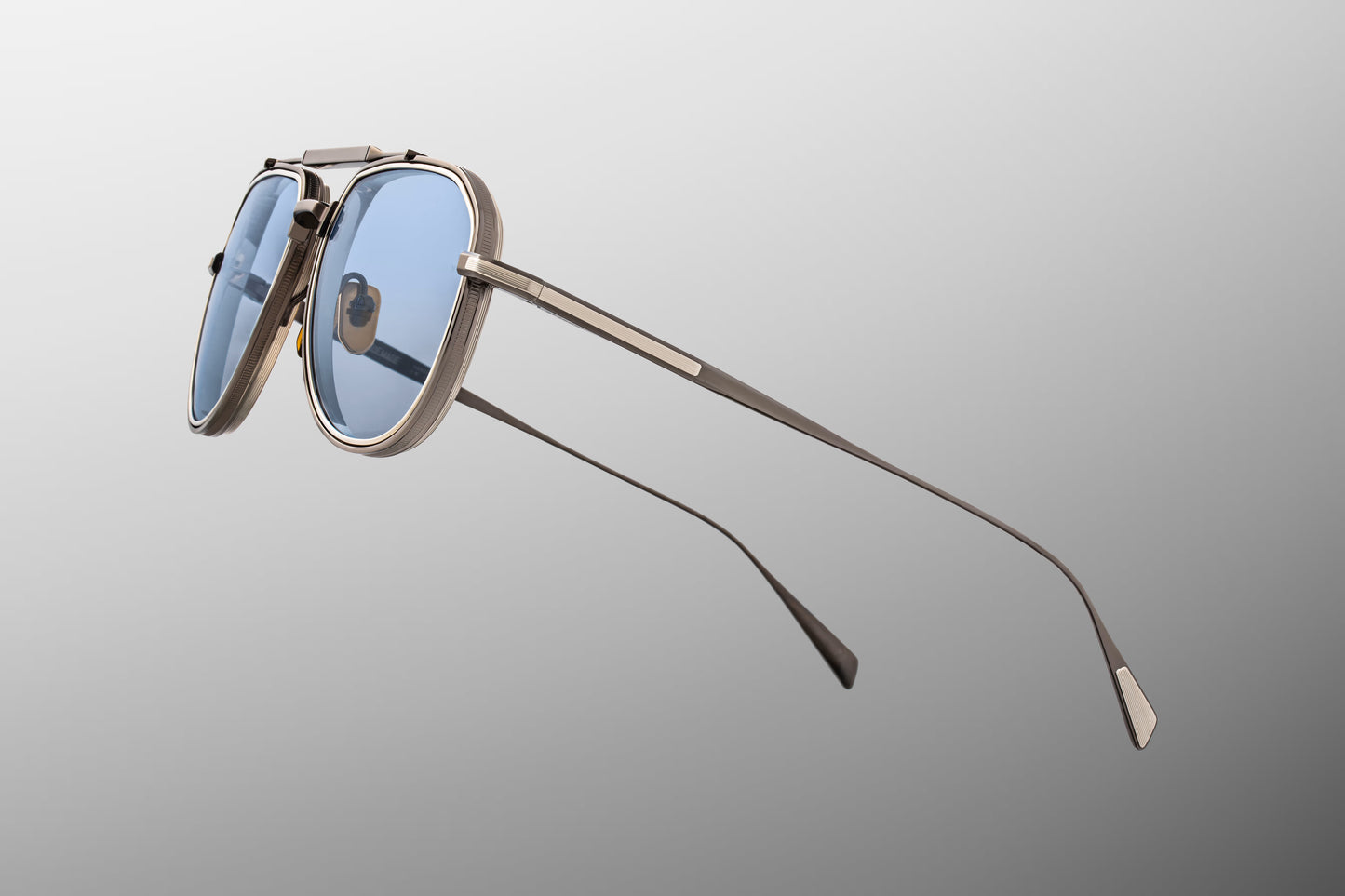 Close-up side detail of Jacques Marie Mage Commander Antique Silver showing engraved titanium temples, hinge construction and wingtip accents
Macro side view of JMM Commander Antique Silver aviators highlighting premium hardware and refined aerospace-grade finish