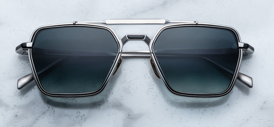 Front view of Jacques Marie Mage Commodore sunglasses in Pacific, featuring a bold blue acetate frame with geometric design, available at WINK Optometrists.