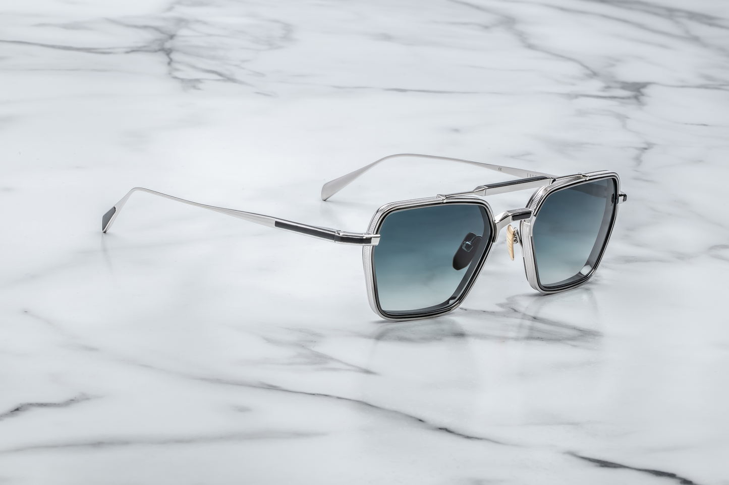 Side profile of Jacques Marie Mage Commodore in Pacific showing sculpted temples, signature metal hinges, and layered blue acetate, available at WINK Optometrists.