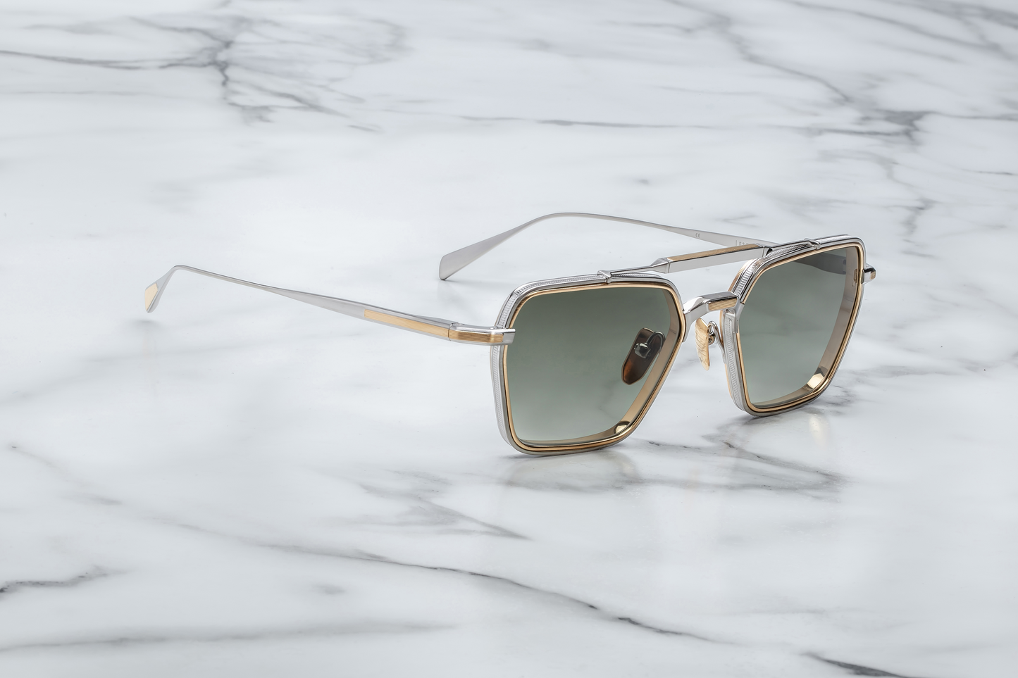 Angled side view of Jacques Marie Mage Commodore Silver sunglasses showing sculptural beta-titanium frame and distinctive double-bridge design.