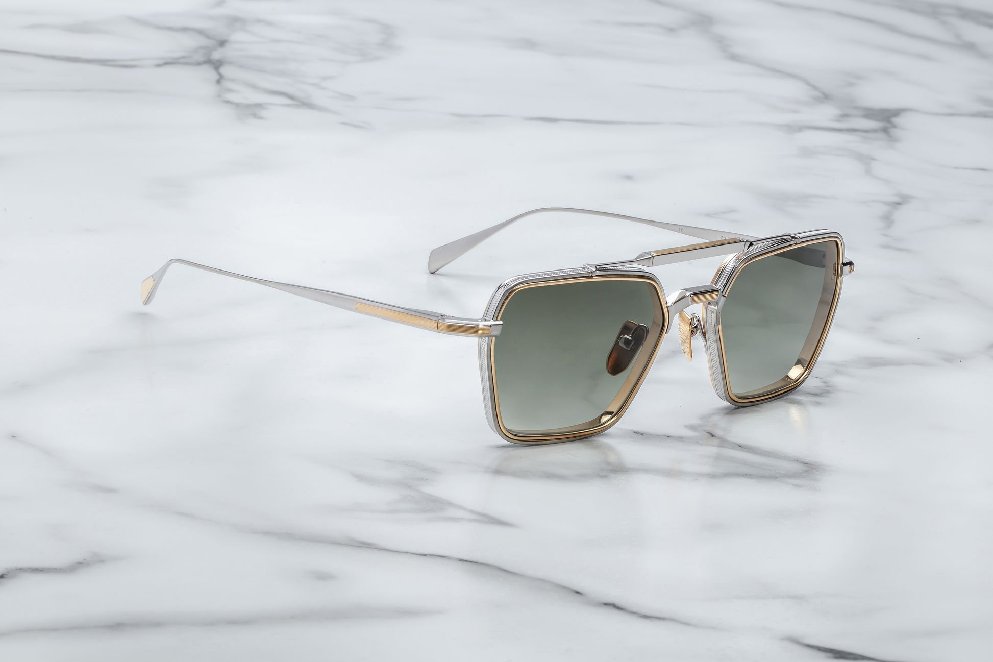 Angled side view of Jacques Marie Mage Commodore Silver sunglasses showing sculptural beta-titanium frame and distinctive double-bridge design.