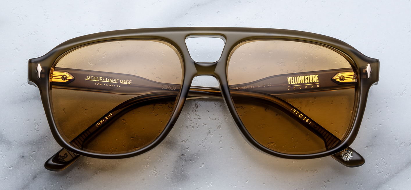 Front view Slip through the undergrowth in sleek ‘80s-inspired spectacles named for the Cougar Creek Pack, whose domain once stretched across the Grayling Creek drainage in Yellowstone’s wild northwest. Balanced and bold, these refined navigators feature a slim silhouette and distinctive double-bridge, handcrafted from polished plant-based acetate in Green Moss. Complemented by lenses in Dandelion yellow, they feature our signature arrowhead front pins, custom 5-barrel hinges, and hairline-engraved 'Spiketa