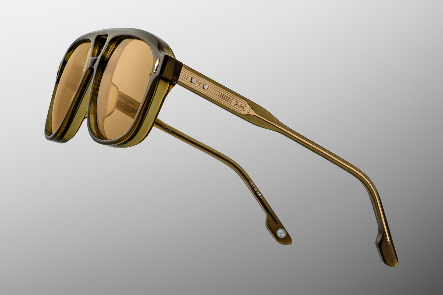 Side view with temple detail. Slip through the undergrowth in sleek ‘80s-inspired spectacles named for the Cougar Creek Pack, whose domain once stretched across the Grayling Creek drainage in Yellowstone’s wild northwest. Balanced and bold, these refined navigators feature a slim silhouette and distinctive double-bridge, handcrafted from polished plant-based acetate in Green Moss. Complemented by lenses in Dandelion yellow, they feature our signature arrowhead front pins, custom 5-barrel hinges, and hairlin