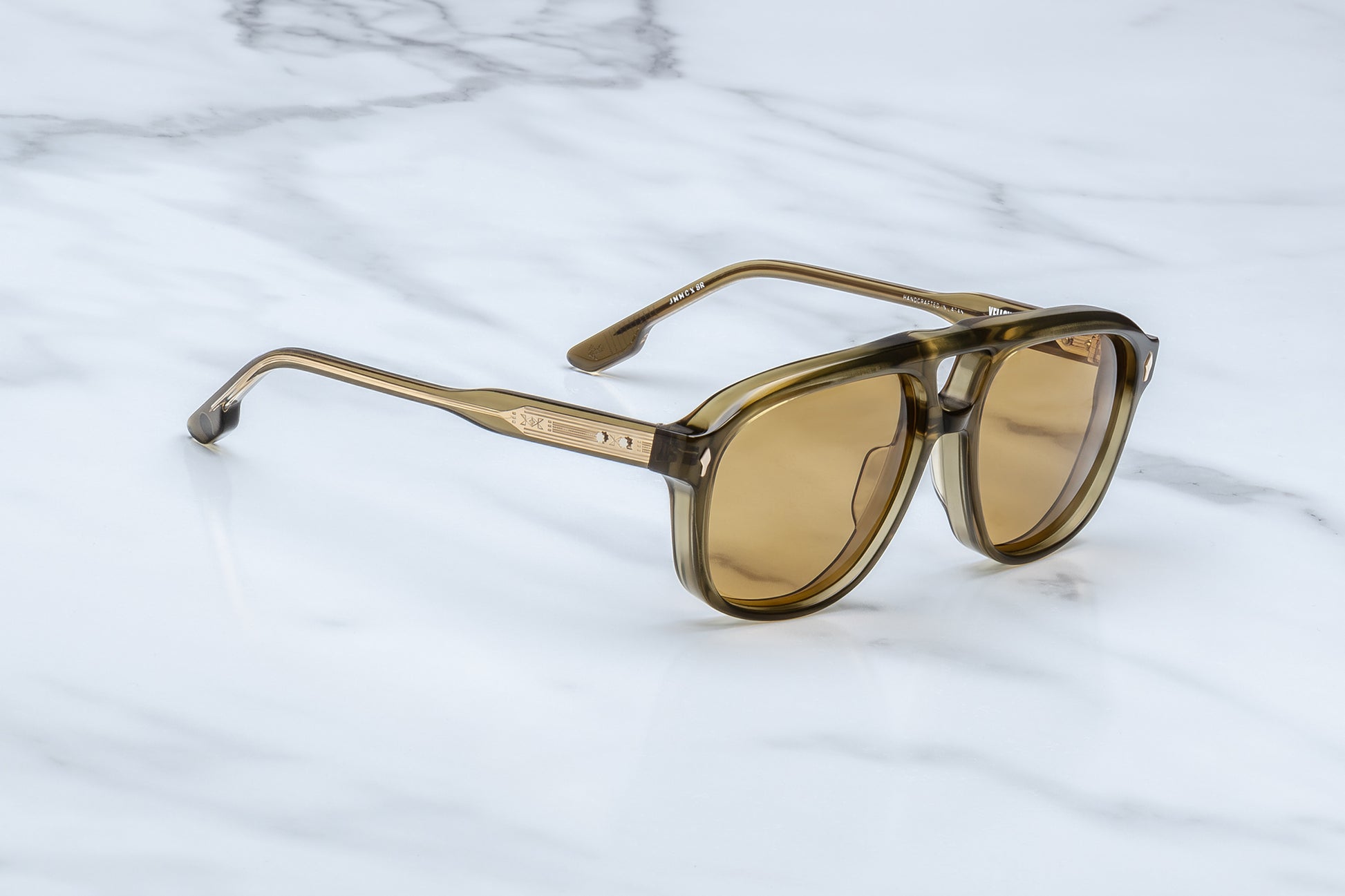 Side view Slip through the undergrowth in sleek ‘80s-inspired spectacles named for the Cougar Creek Pack, whose domain once stretched across the Grayling Creek drainage in Yellowstone’s wild northwest. Balanced and bold, these refined navigators feature a slim silhouette and distinctive double-bridge, handcrafted from polished plant-based acetate in Green Moss. Complemented by lenses in Dandelion yellow, they feature our signature arrowhead front pins, custom 5-barrel hinges, and hairline-engraved 'Spiketai
