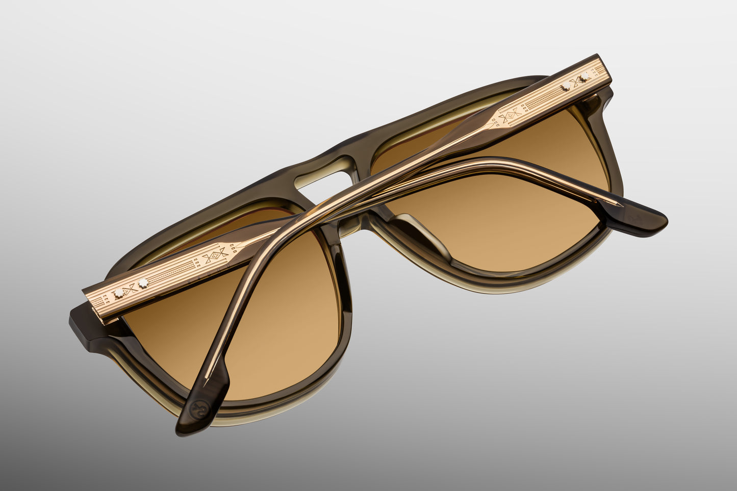 Back view with temple detail. Slip through the undergrowth in sleek ‘80s-inspired spectacles named for the Cougar Creek Pack, whose domain once stretched across the Grayling Creek drainage in Yellowstone’s wild northwest. Balanced and bold, these refined navigators feature a slim silhouette and distinctive double-bridge, handcrafted from polished plant-based acetate in Green Moss. Complemented by lenses in Dandelion yellow, they feature our signature arrowhead front pins, custom 5-barrel hinges, and hairlin