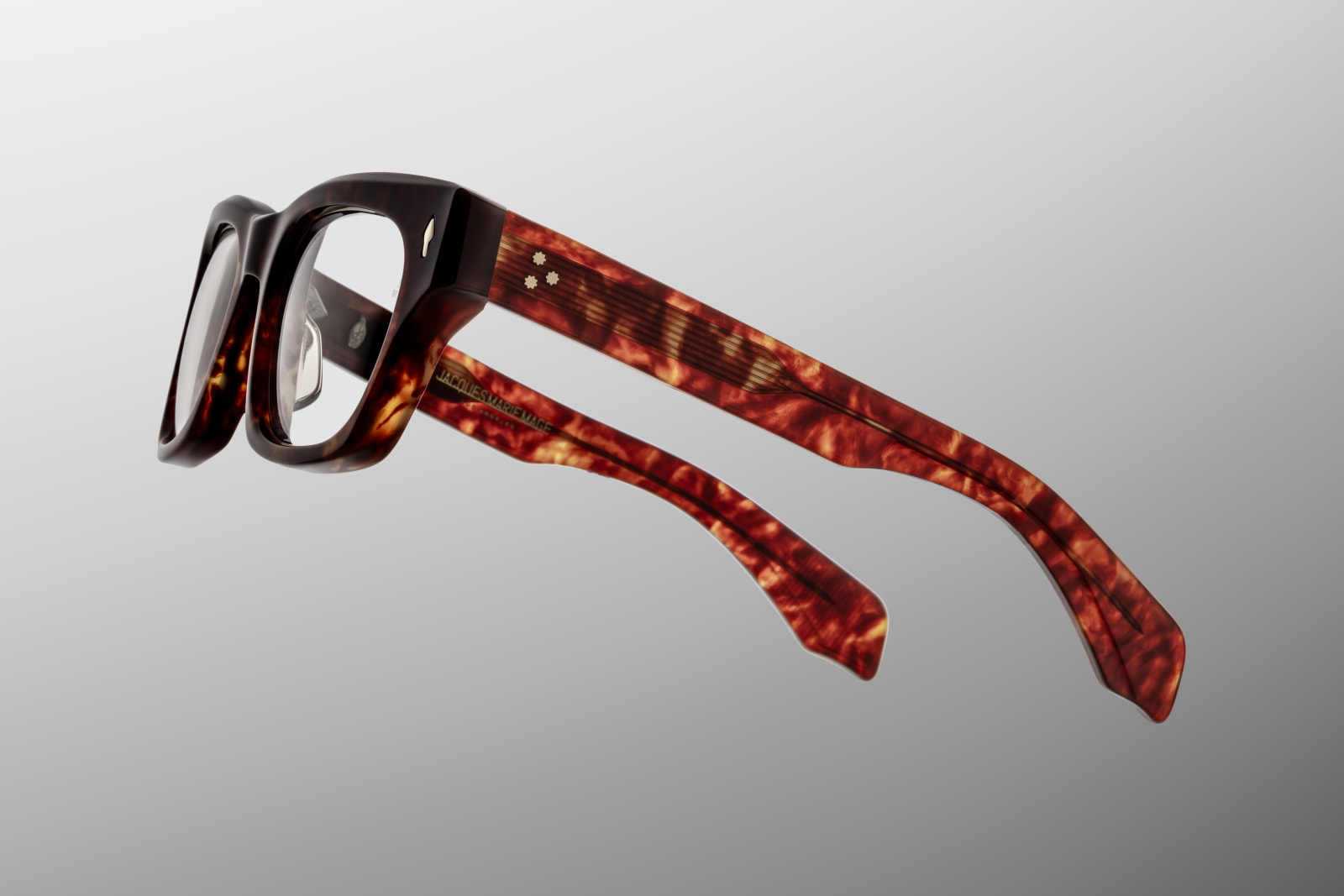 Close-up side view of Jacques Marie Mage Dealan 53 Breccia optical glasses highlighting custom double laminated acetate temples, hidden wire core with hairline engraving and light gold tension-secured 7-barrel hinges — available at WINK Optometrists Australia