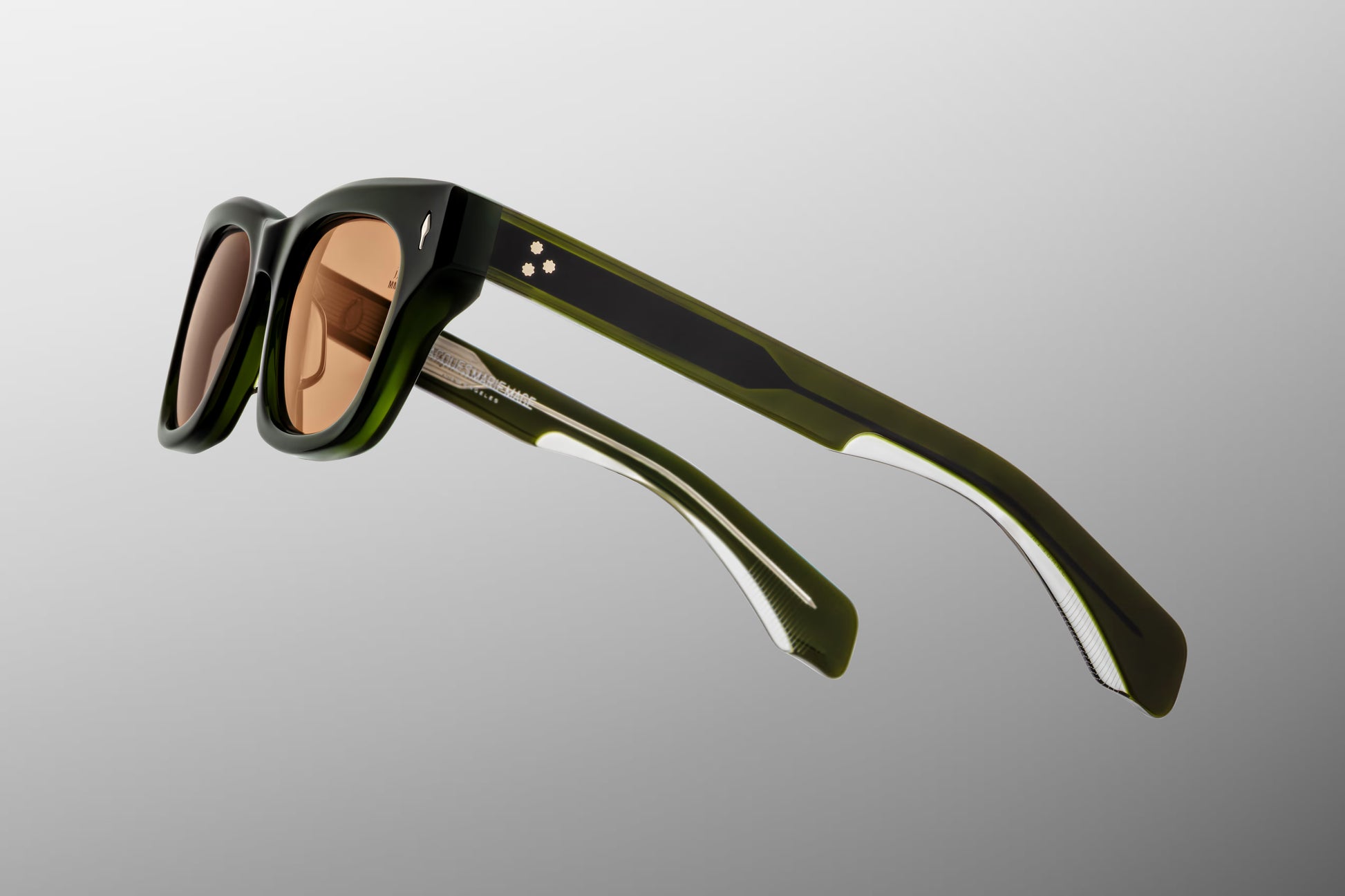 Jacques Marie Mage Dealan 50 Borneo sunglasses temple detail with engraved wirecore, custom hardware and signature arrowhead pins in luxury acetate