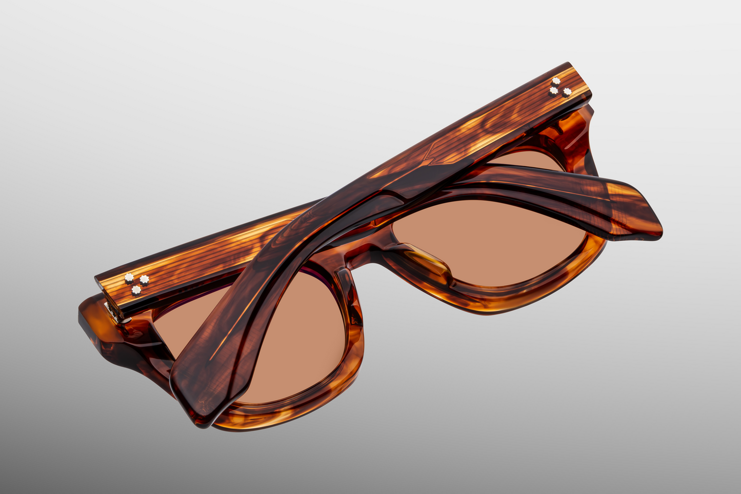 Close up back detail of Jacques Marie Mage Dealan Bourbon sunglasses highlighting handcrafted Japanese acetate frame construction – available at Wink Optometrists
