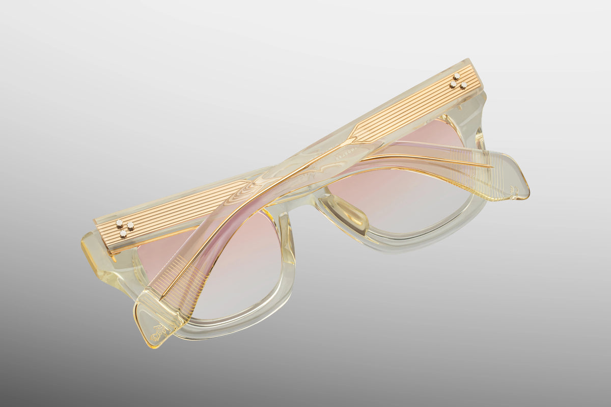 Close-up interior detail shot of the Jacques Marie Mage Dealan Halo frame architecture. The inner view showcases the translucent beige rims against the premium light gold metallic hardware. Clean silver foil-stamped text on the inner temple arm indicates the individual limited-edition serial number out of the exclusive global batch of 300 alongside the "Handcrafted in Japan" production text. Available at WINK Optometrists.