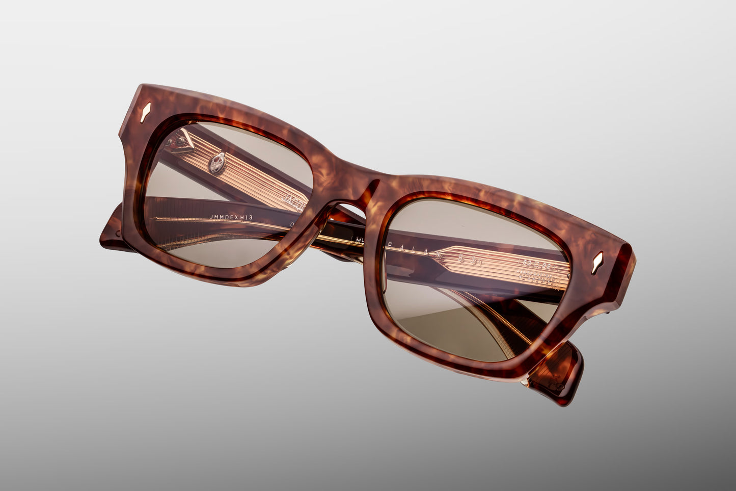  Top-down macro shot of Jacques Marie Mage Dealan 53 Honeycomb sunglasses, highlighting the substantial 10mm thickness of the Havana acetate frame and the embedded light gold metal hardware.