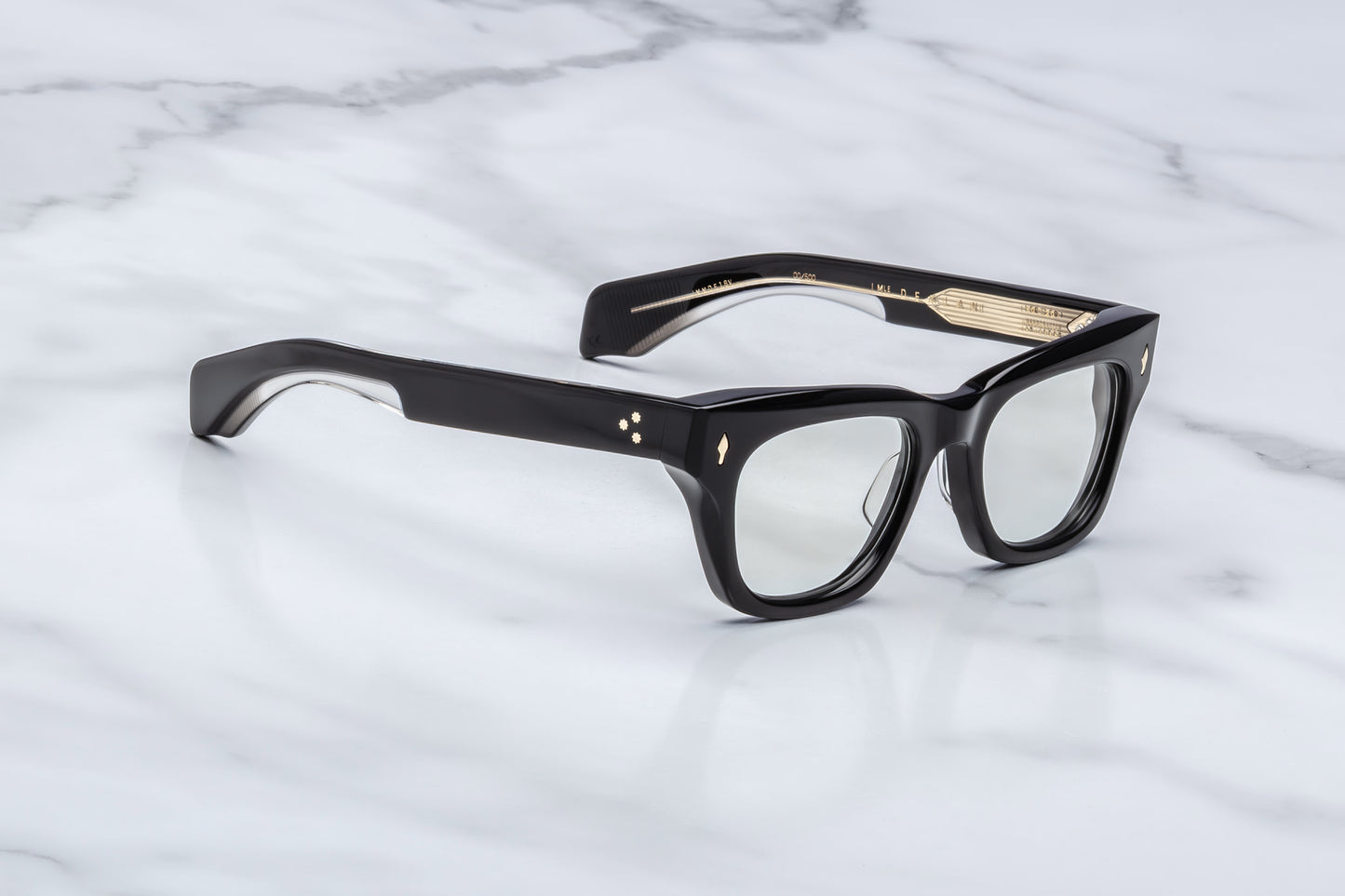Jacques Marie Mage Dealan Venom RX optical glasses three quarter angle showing sculpted black acetate frame, green CR39 lenses and premium handcrafted construction
