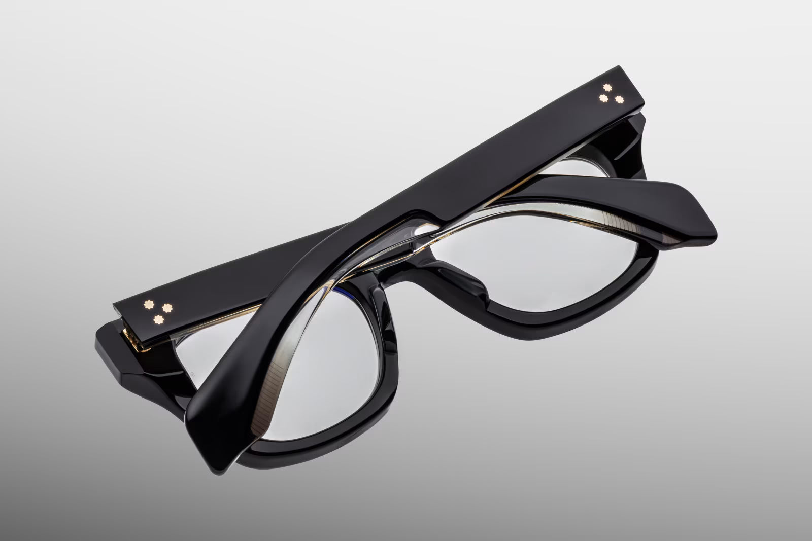 Jacques Marie Mage Dealan Venom eyeglasses detail of custom gold hardware, 7 barrel hinge and engraved wirecore in luxury handcrafted acetate frame