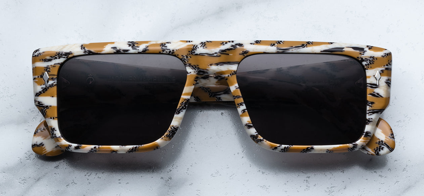 Front view of Jacques Marie Mage Devoto Cheetah sunglasses at WINK Optometrists Melbourne — rectangular 9 mm patterned cheetah‑print acetate frame with bold brow‑line, grey lenses.