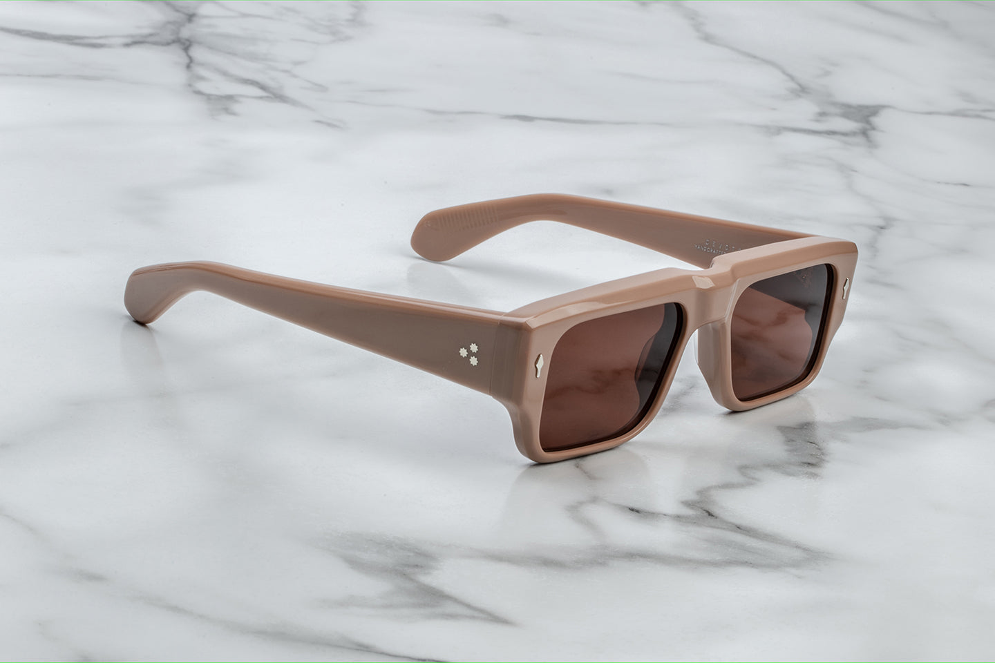Side view of Jacques Marie Mage Devoto Porter – brown acetate temple, signature silver arrowhead front pins, hidden wire‑core checkerboard detail, limited edition